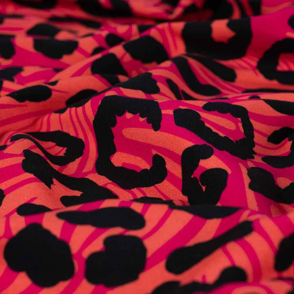 French Terry, Leo Musterung Koralle / Pink / Schwarz